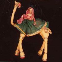 Rajasthani lady riding a <em>c</em>amel, a <em>kathputli</em> string puppet from Rajasthan, India, height: 46 <em>c</em>m. Colle<em>c</em>tion: Center for Puppetry Arts (Atlanta, Georgia, United States). Photo courtesy of Center for Puppetry Arts
