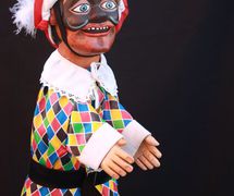 Arlecchino, a <em>burattino</em> (glove puppet) in the Bergamo tradition by puppeteer Pietro Roncelli (Brembate di Sopra, Bergamo, Italy). Photo courtesy of Bruno Ghislandi