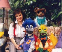 Cast of television series <em>Under the Umbrella Tree</em> (1986-1993). Holly Larocque and three glove and rod puppets, Iggy, Gloria and Jacob, design and fabrication: Noreen Young. Collection: Noreen Young Productions. Photo courtesy of CBC