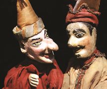 Two <em>Petrushka</em>s of Russian folk puppeteers Ivan Zaitsev (left) and Pavel Sedov (right). Glove puppets (wood, fabric), late 19th-turn of 20th century. Photo courtesy of Collection: Gosudarstvenny akademichesky tsentralny teatr kukol imeni S.V. Obraztsova, Puppetry Museum (Moscow, Russia)