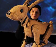 Harri the Hare, in <em>The Lightning Path</em> (2016) by Small World Theatre (Cardigan, Wales, UK), direction: Ann Shrosbree, puppet design/construction: Toby Downing, puppeteer featured in the photo: Rhiannon Willis. Puppet, height: 1.0 m. Direct manipulation puppetry, shadows, multimedia (animation and sound), actors, masks. Photo: Sam Vicary